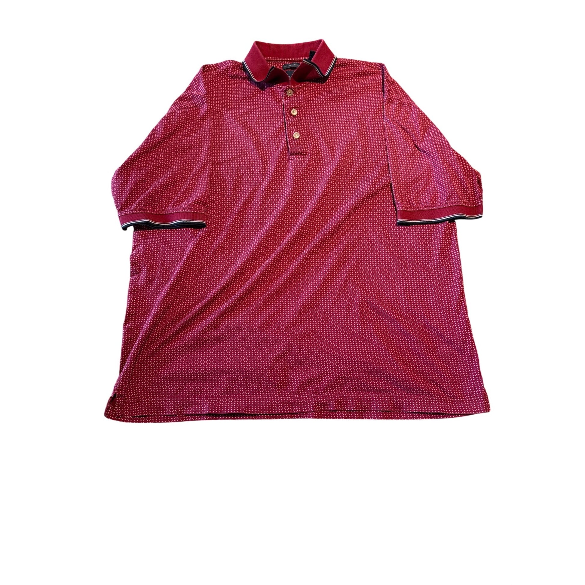 A short-sleeve polo shirt in a textured red and black micro-check pattern, featuring a two-button placket and contrasting dark trim on the collar and sleeve cuffs, laid flat against a white background.