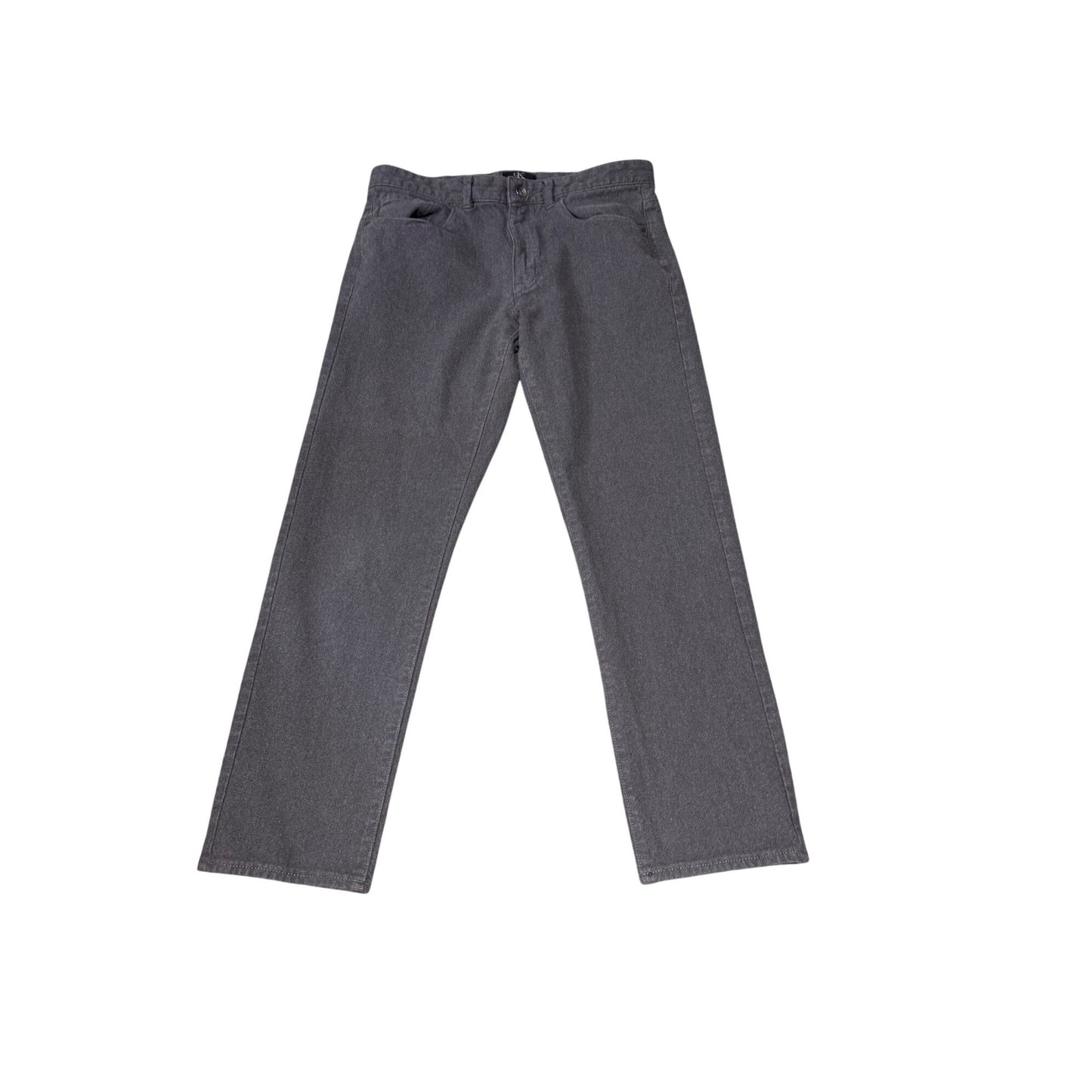 A pair of dark gray slim-fit jeans laid flat against a solid white background.