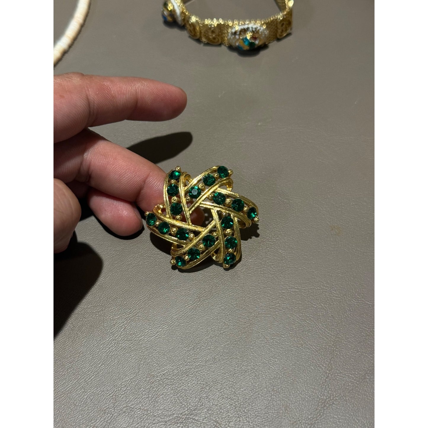 Vintage Gold Tone Green Rhinestone Brooch Pinwheel Swirl Emerald Pin