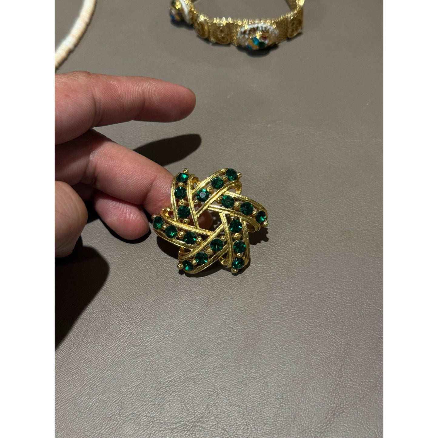 Vintage Gold Tone Green Rhinestone Brooch Pinwheel Swirl Emerald Pin