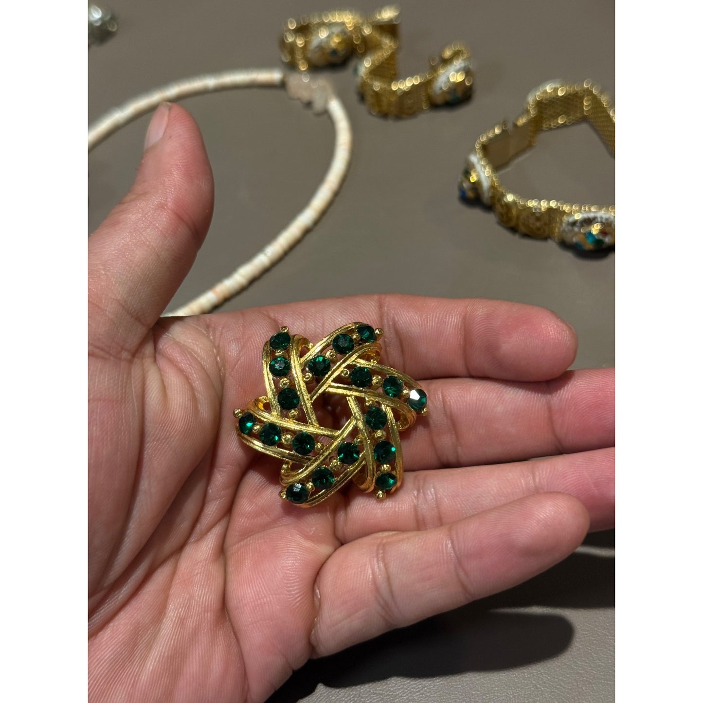 Vintage Gold Tone Green Rhinestone Brooch Pinwheel Swirl Emerald Pin
