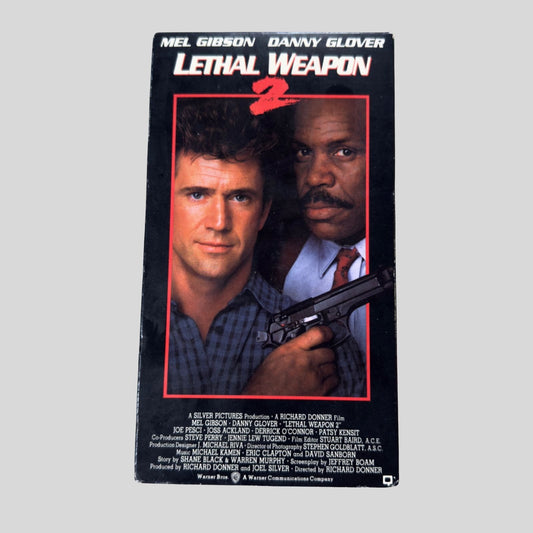 VHS cover of 'Lethal Weapon 2' featuring Mel Gibson and Danny Glover with a gun.