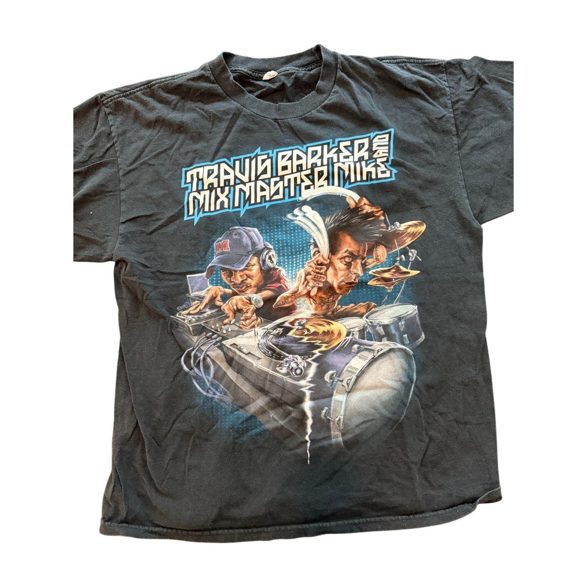 A vintage black graphic t-shirt featuring the text 'TRAVIS BARKER MIX MASTER MIKE' above a colorful illustration of two DJs mixing music with turntables and headphones.