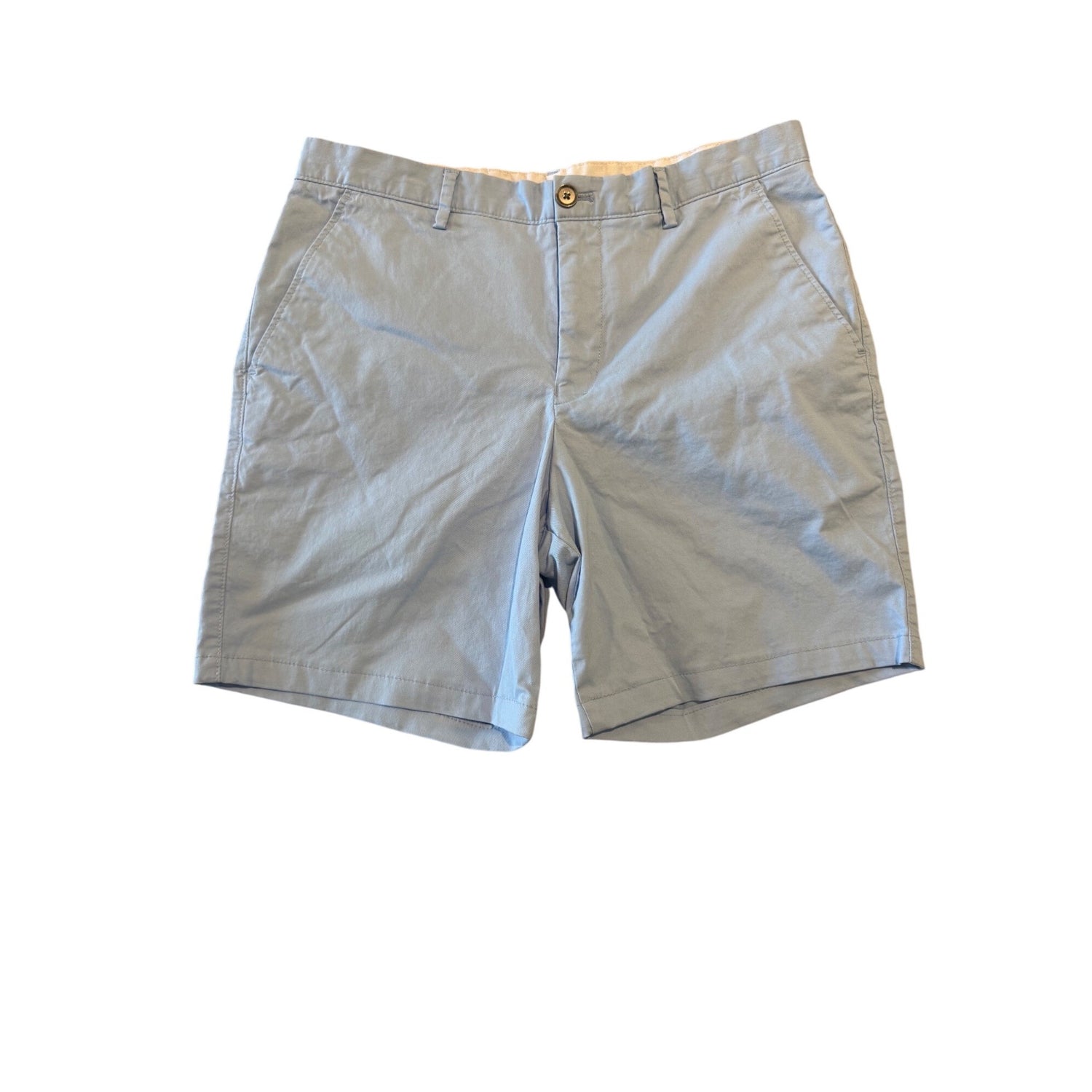 A pair of light blue chino shorts laid flat against a white background.