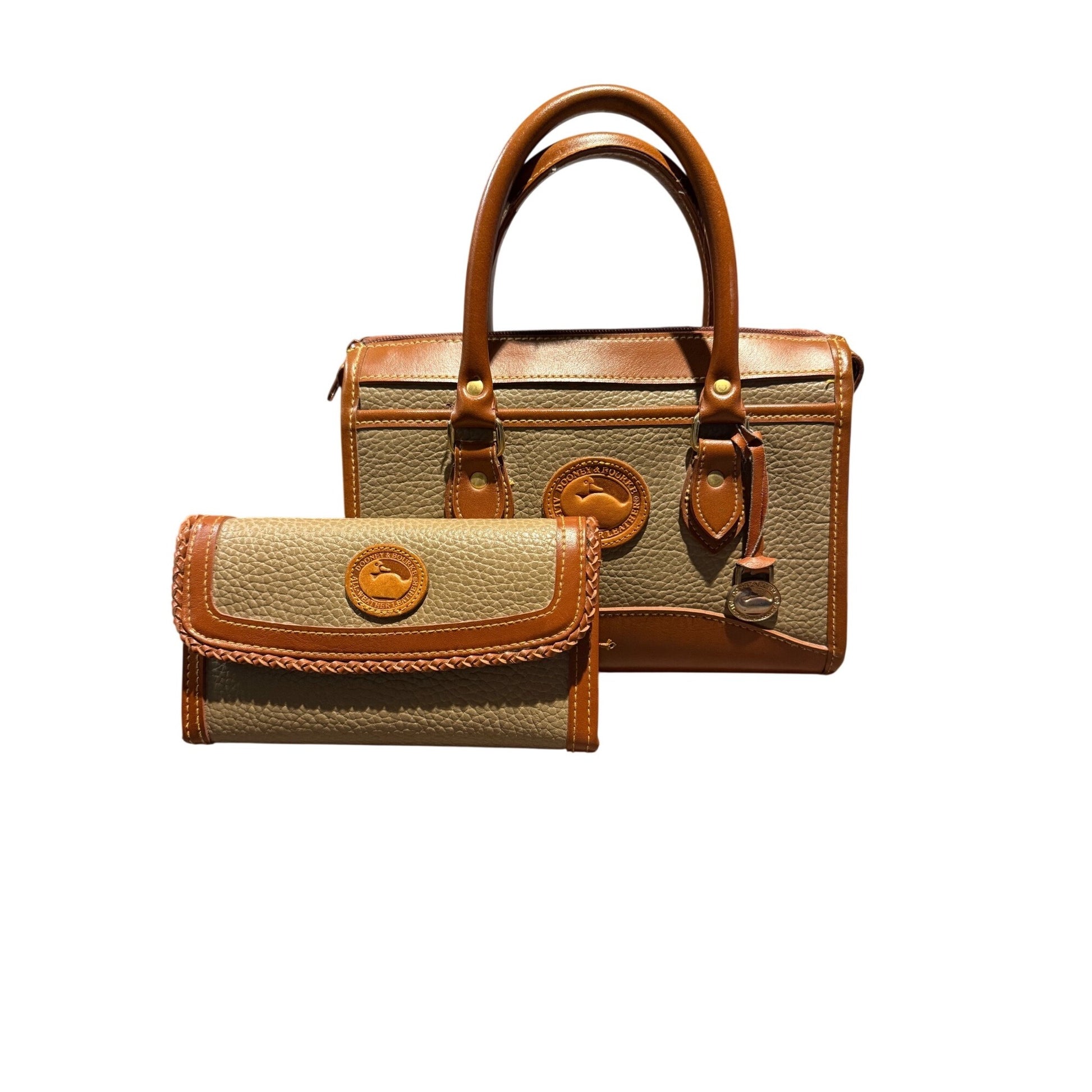 A matching handbag and wallet set on a plain white background. The set includes a structured top-handle satchel and a matching fold-over wallet, both in a textured beige fabric with tan leather trim and handles.