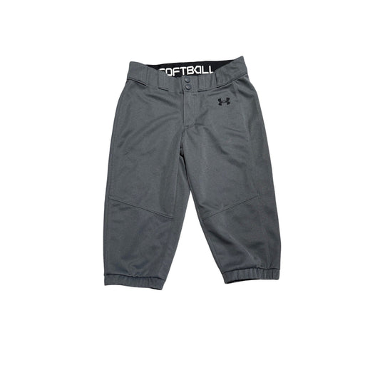 Gray Under Armour youth softball pants with a black waistband and white 'SOFTBALL' text, shown flat on a white background.