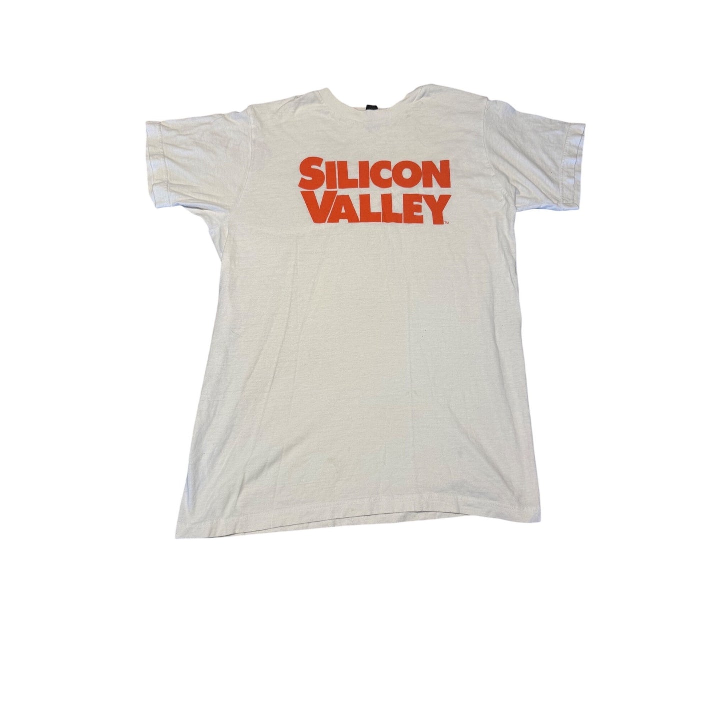 A vintage white t-shirt with 'SILICON VALLEY' printed in bold orange letters across the chest, laid flat against a white background.