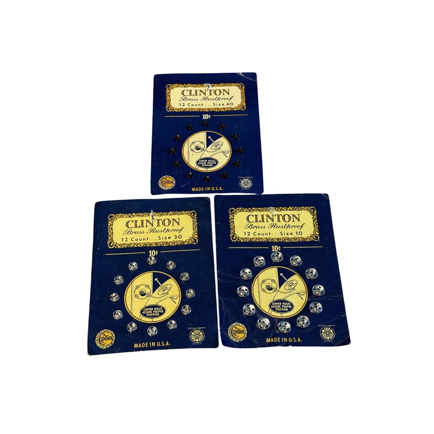 Three blue and gold packages of Clinton Diamond Waterfowl No. 10 Barbed Wire, arranged in a triangle on a white background.
