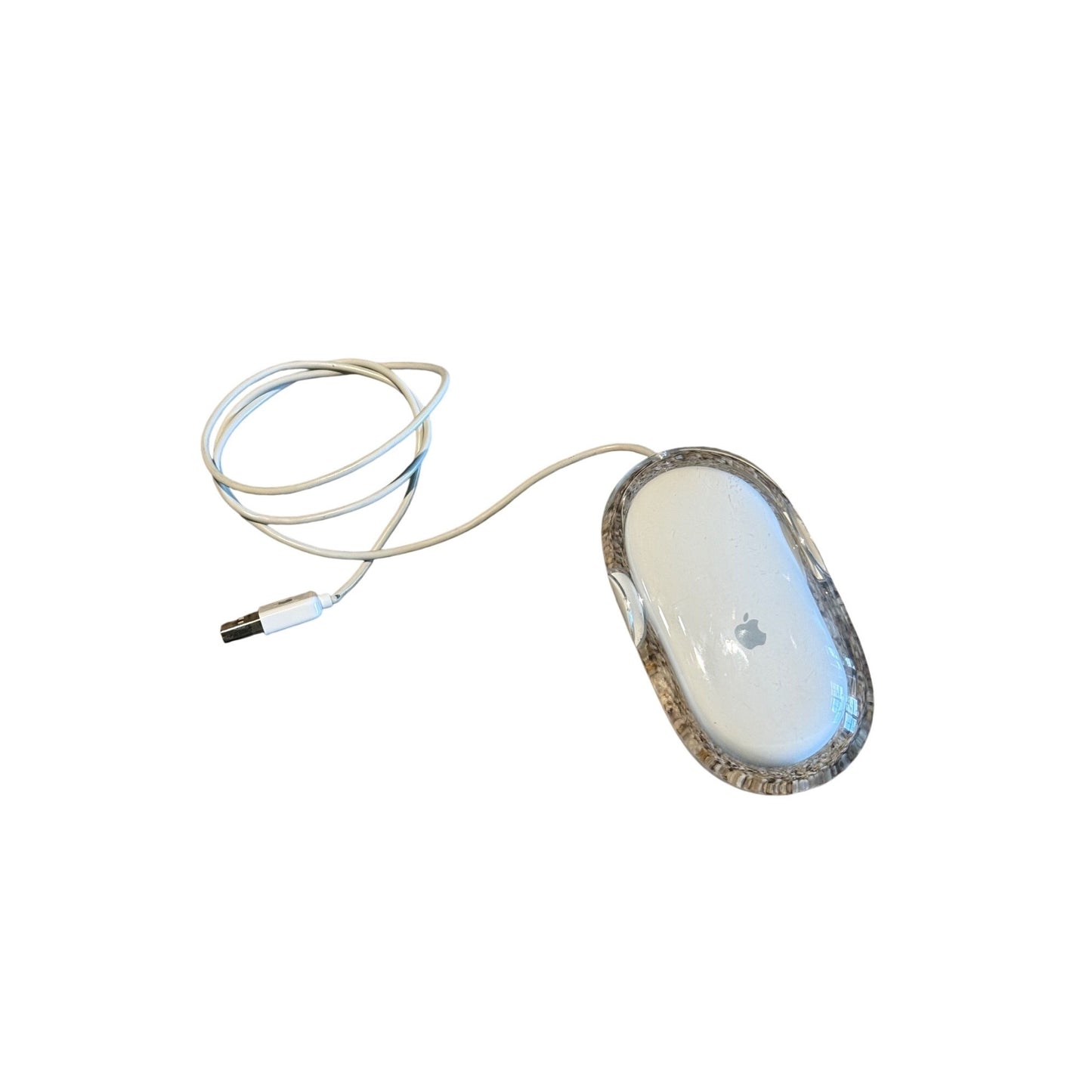 An Apple Magic Mouse wireless computer mouse with a clear protective case and a white cable, shown on a plain white background.
