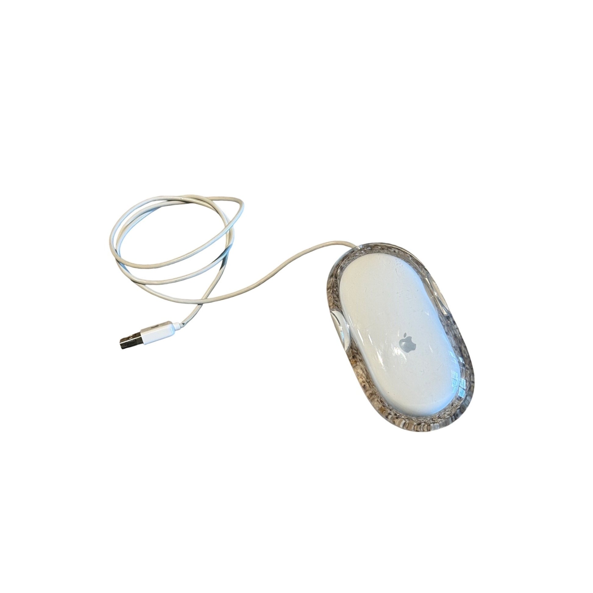 An Apple Magic Mouse wireless computer mouse with a clear protective case and a white cable, shown on a plain white background.