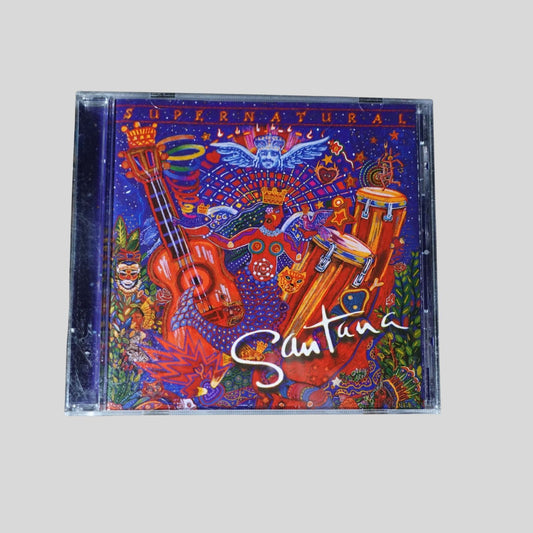 CD cover of 'Supernatural' by Santana with colorful design and instruments.